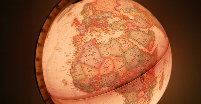 Photo of Africa on a globe by Maksim Shutov on Unsplash