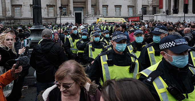 Police officers during covid restrictions in UK, by Ehimetalor Akhere Unuabona on Unsplash