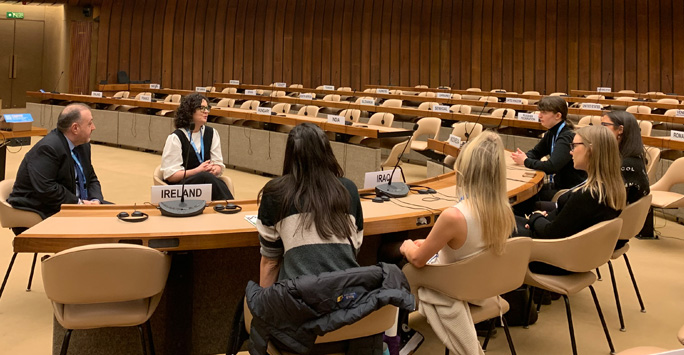 LLM students in conversation with diplomats.