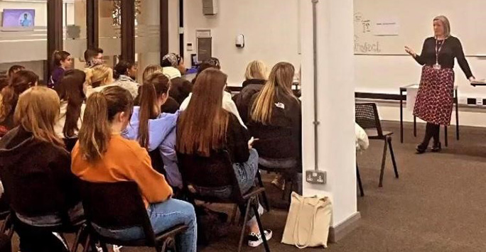 Students listen to a talk from a previous Liverpool Law Clinic student