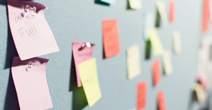 Post-it notes on a wall to symbolise planning