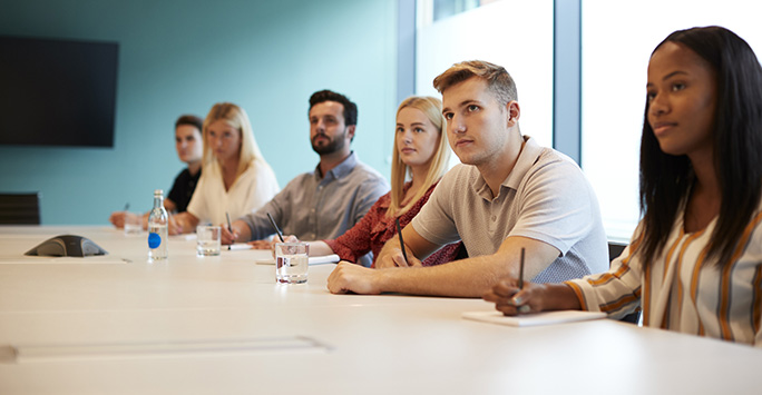 Students sat around table