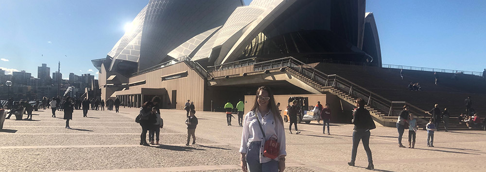 Student outside Sydney Opera House