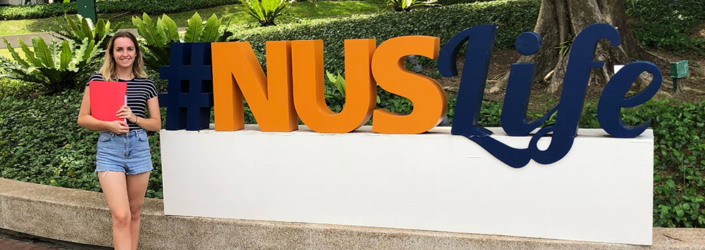 Student with NUS sign