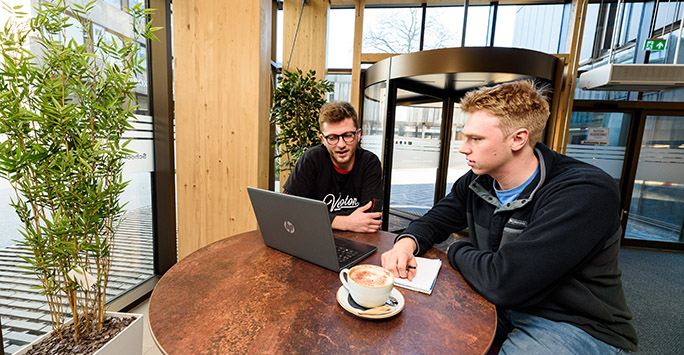 Students socialising in SLSJ Building