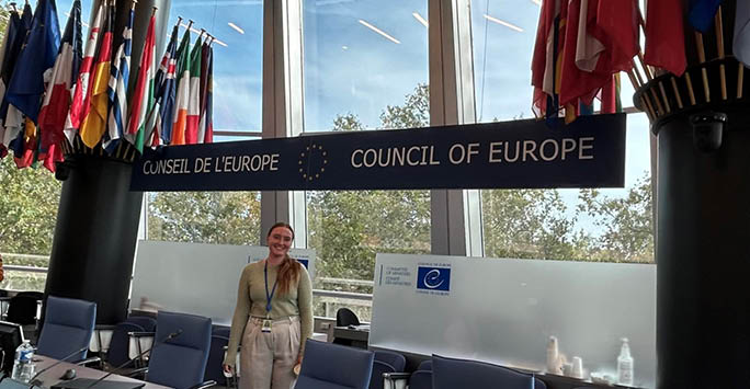 Victoria Hawley in front of Council of Europe sign