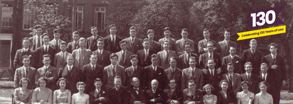 Archive image of Faculty of Law staff and students with 130 Years of Law logo