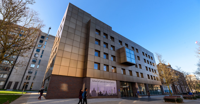 Exterior shot of the School of Law and Social Justice Building on a sunny day