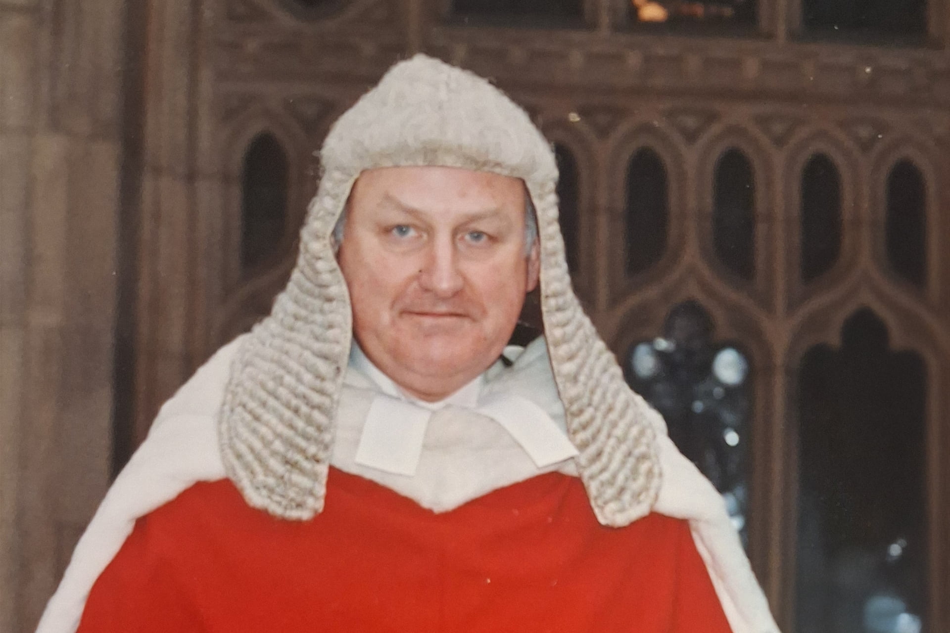 Headshot of Sir Mark Hedley wearing traditional judicial robes.
