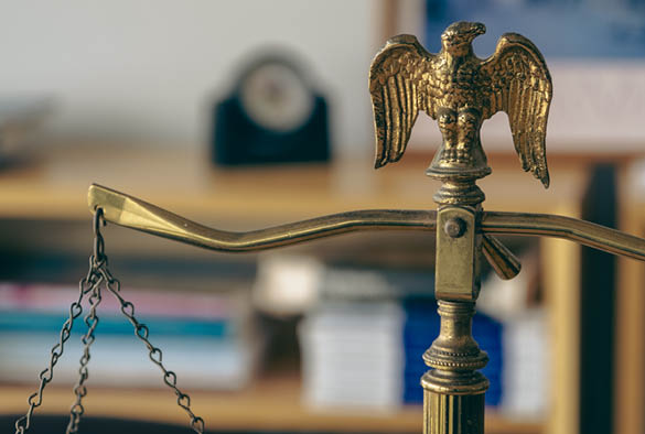 A weighing scales in gold