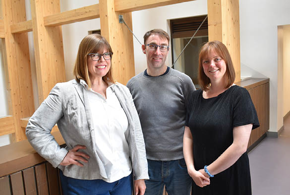 A photo of James Organ, Jen Sigafoos, and Sophie Wickham in the Law and Social Justice Building