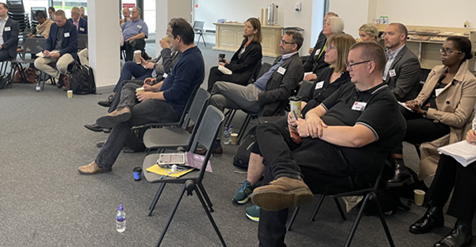 Seated audience at symposium