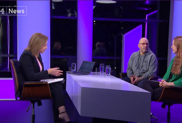 Channel 4 news room with presenter and Paul Walmsley and Alyssa Cole sat on chairs