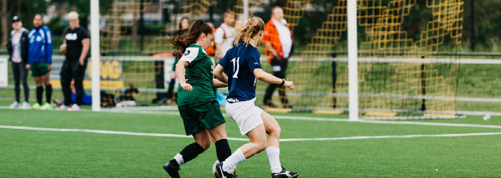 Two girls playing football image