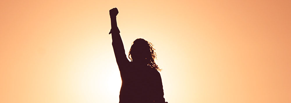 Woman with fist raised in the air