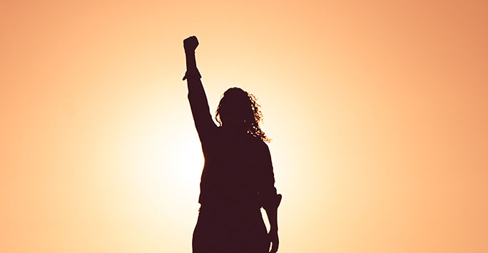 Woman with fist raised in the air