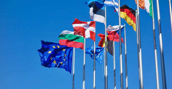 A collective of European Flags on a bright blue sky