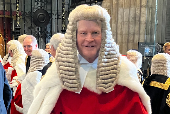 Mr Justice Cawson dressed in traditional judicial robes and wig.