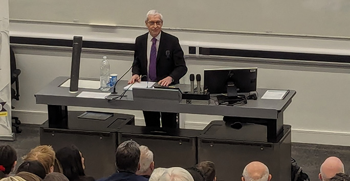 Lord Burrows at the front of a lecture theatre