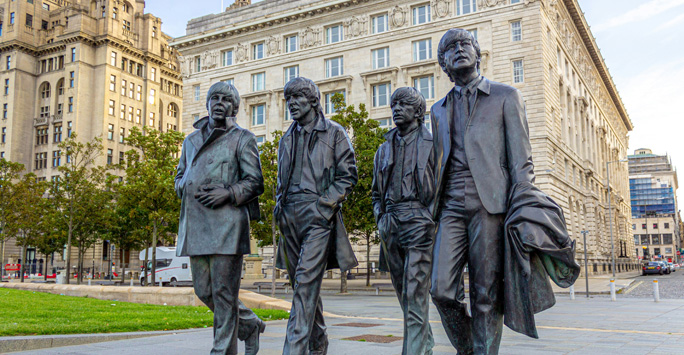 The beatles statue on the Liverpool Waterfront. The statue is bronze sculpture of all beatles members.