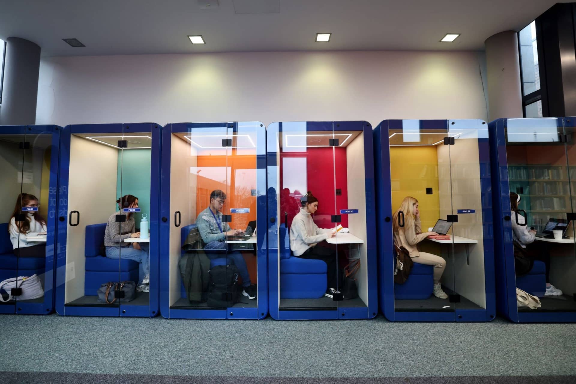 Students sitting in study pods in the Sydney Jones Library