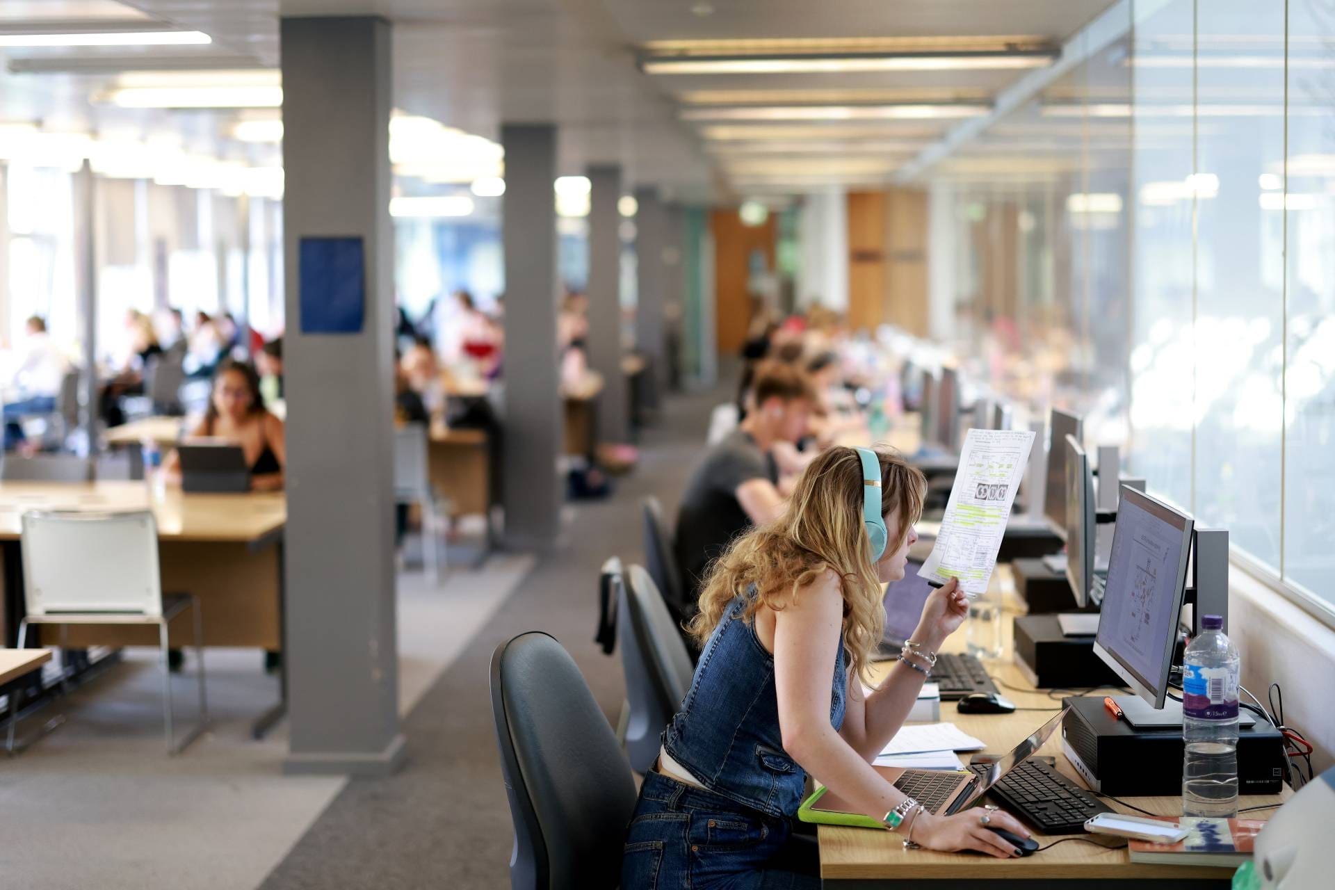 A student studying in the Sydney Jones Library