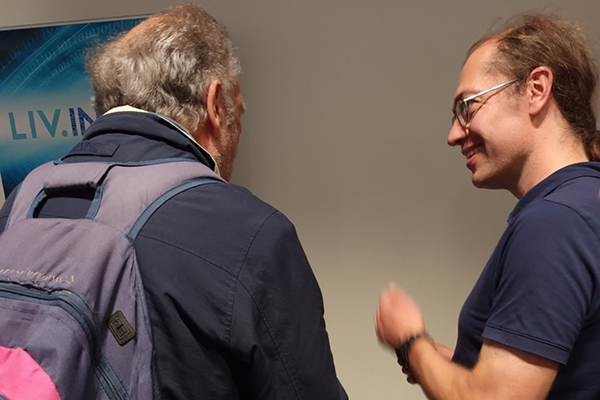 Two people talking to each other.