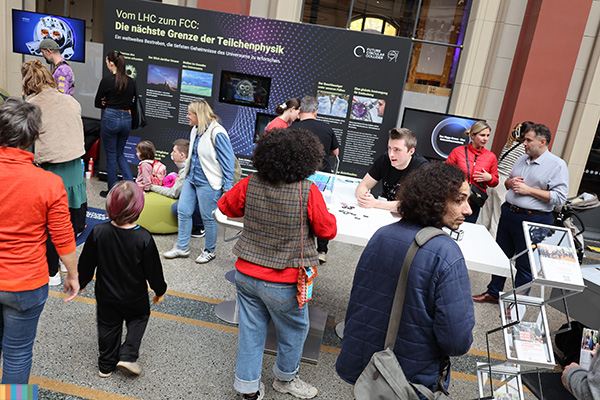 Visitors at a science open day in a museum.