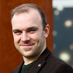 A person posing for a photo.