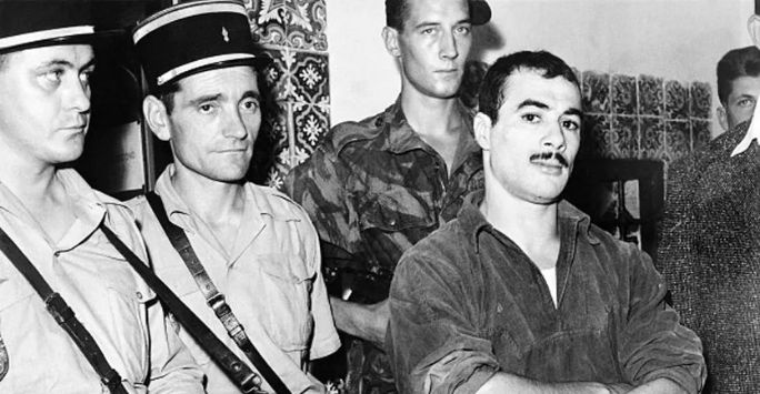 Yacef Saadi, military leader of the FLN National Liberation Front networks of the autonomous zone of Algiers, poses after being captured at the end of the “Battle of Algiers”
