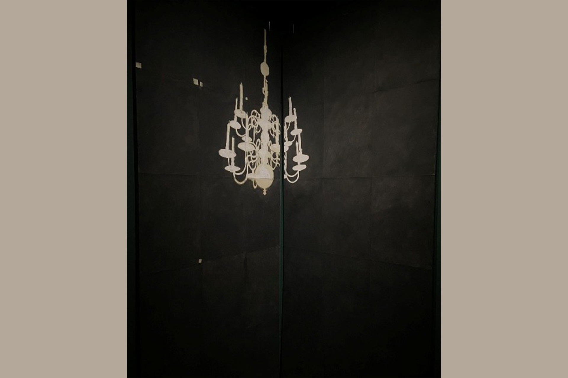 Painting of a chandelier on a black background.