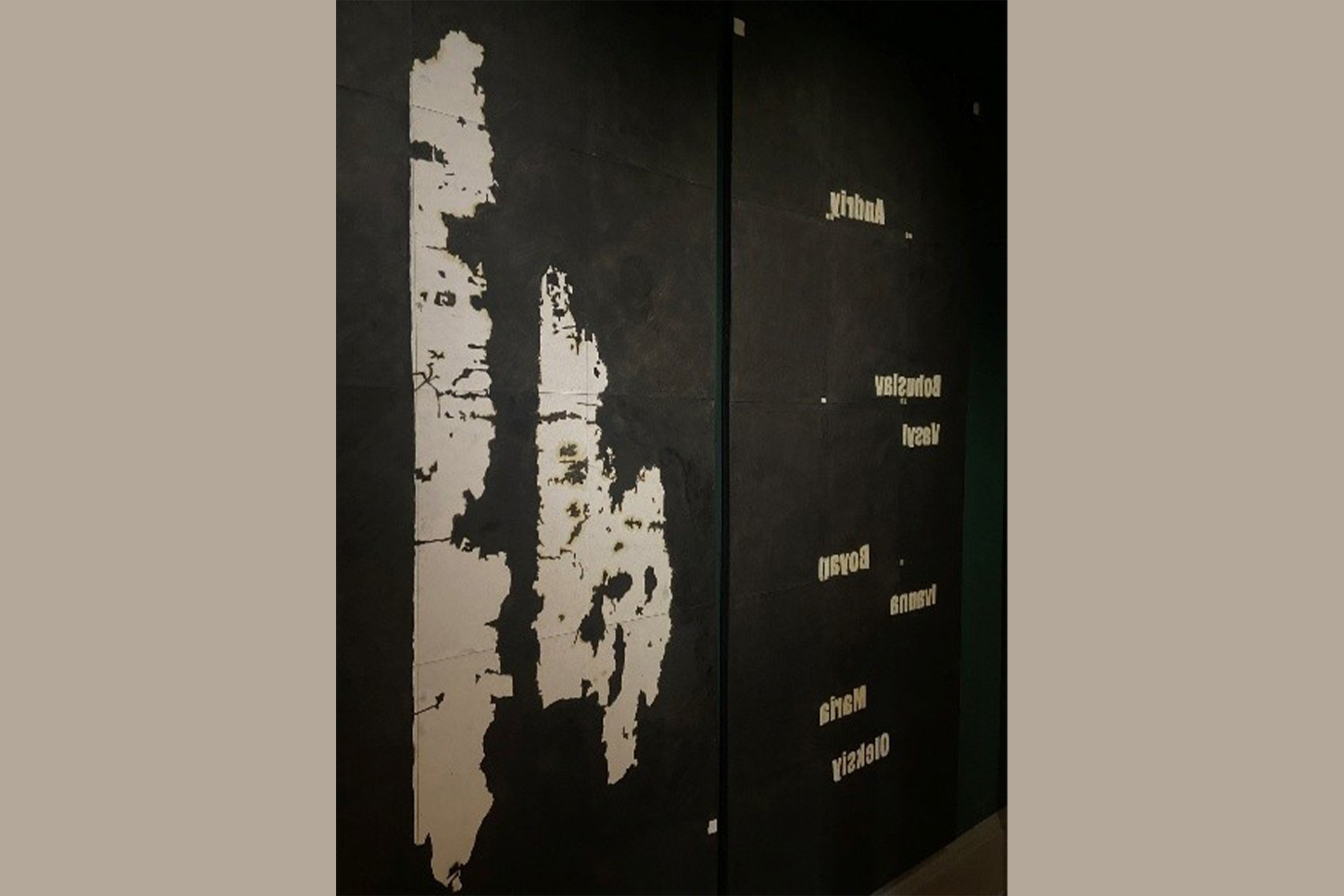 A painting of a map and painting on a black background, with the names spaced out on it.