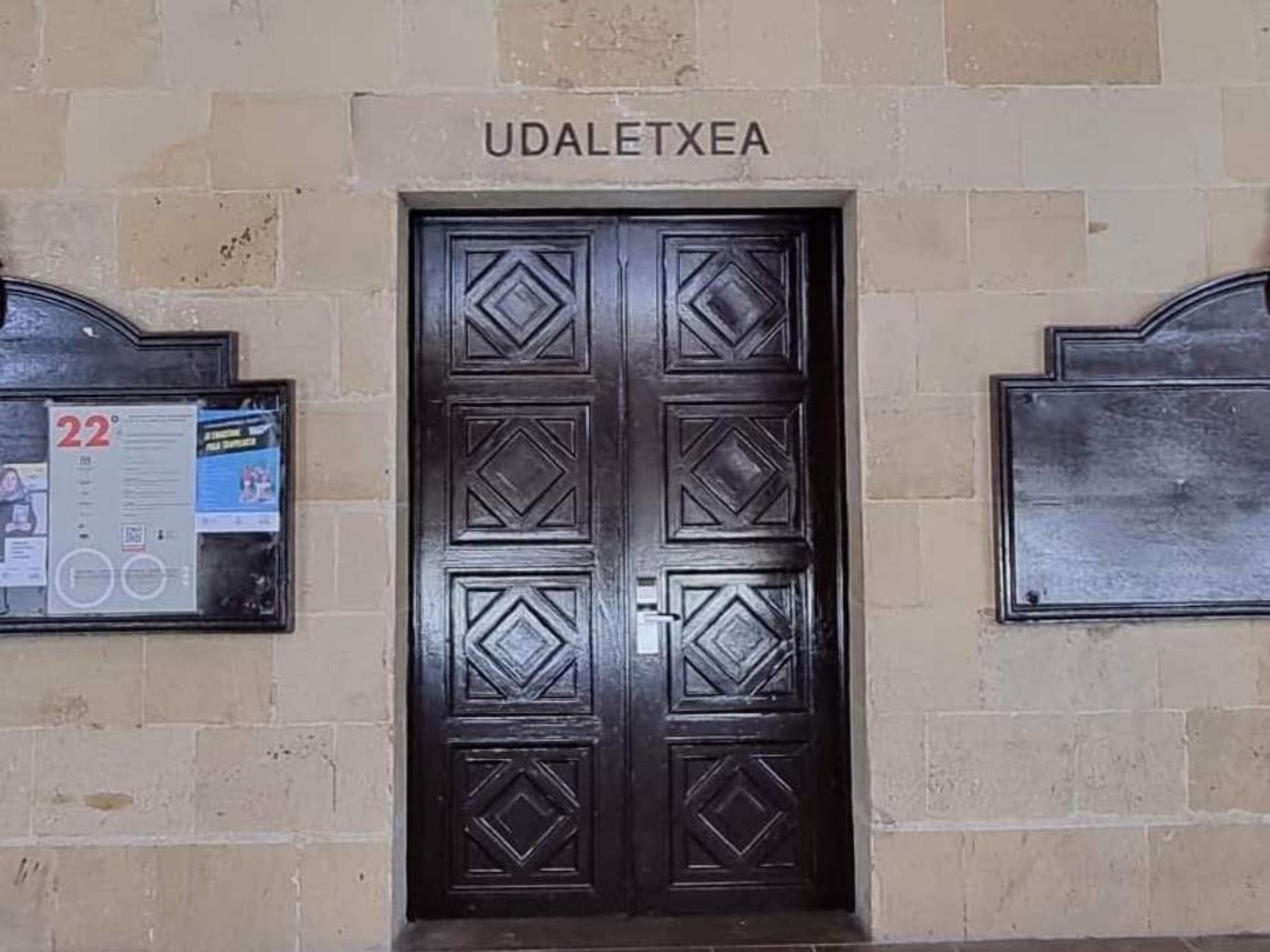 Street sign in front of a town hall