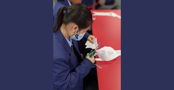 Photograph of a student completing a craft during China Day