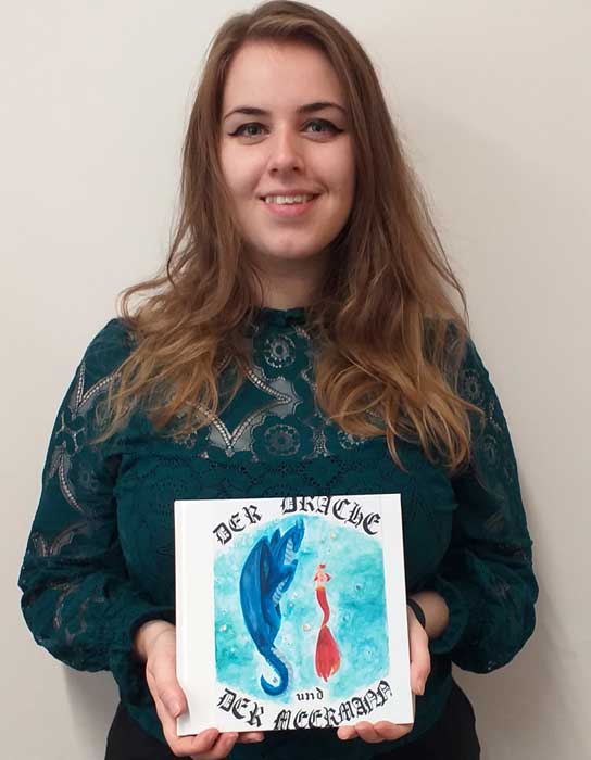 Student Sarah Bresnahan with her illustrated book