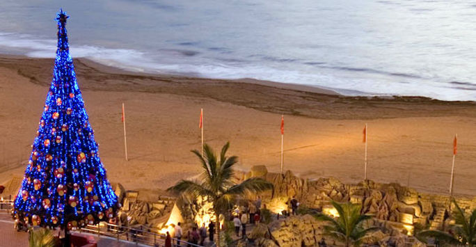 A Christmas tree overlooking a beach in the Canary Islands