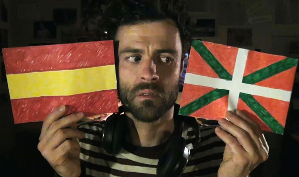 Man holding two flags
