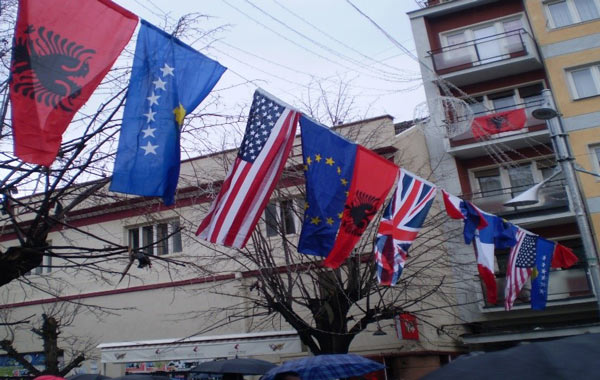 Flags from different countries flying in a city