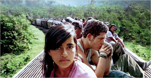 Children sitting on a train Teens on La Bestia
