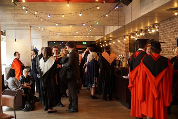 Students and their families at the graduation reception