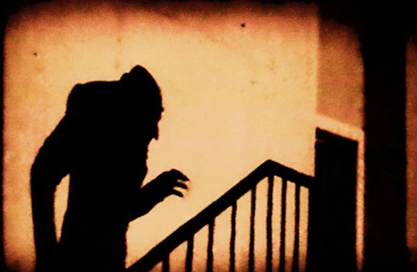 Silhouette of a vampire climbing the stairs
