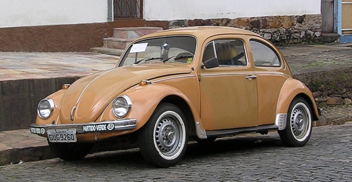 an orange vintage VW beetle