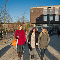 Students walking outside the Sydney Jones Library