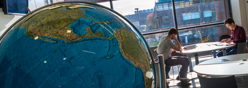 Globe and students studying