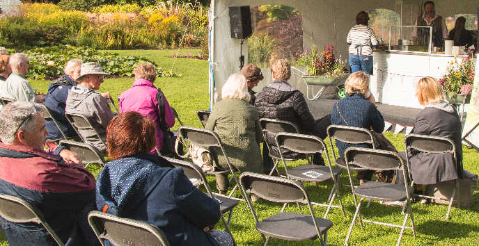 people attending a talk outdoors in Ness Gardens