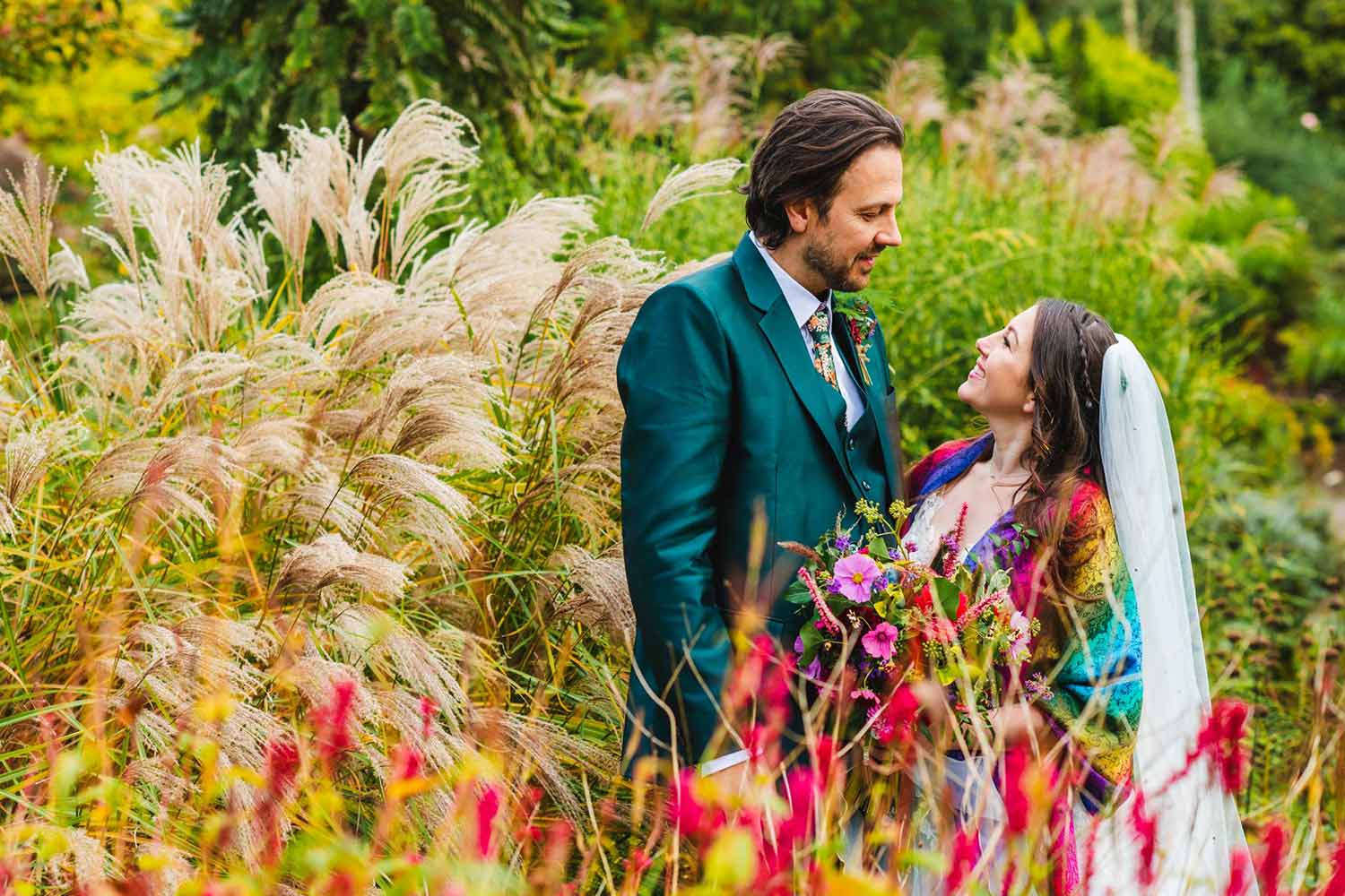 A couple enjoy the stunning surroundings at Ness as they walk through the gardens after their wedding ceremony.