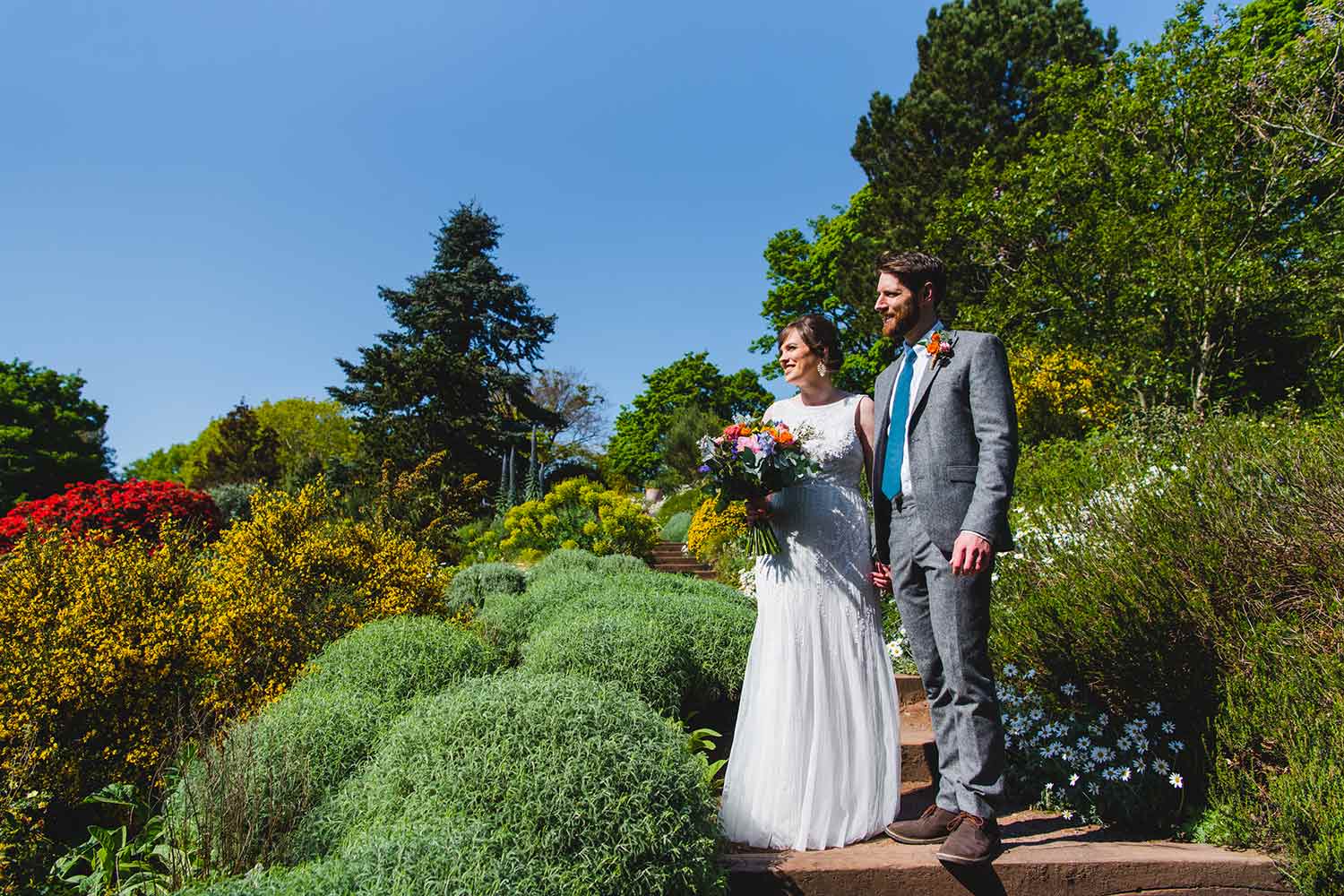 A couple take in the stunning surroundings as they walk round Ness after their wedding ceremony.