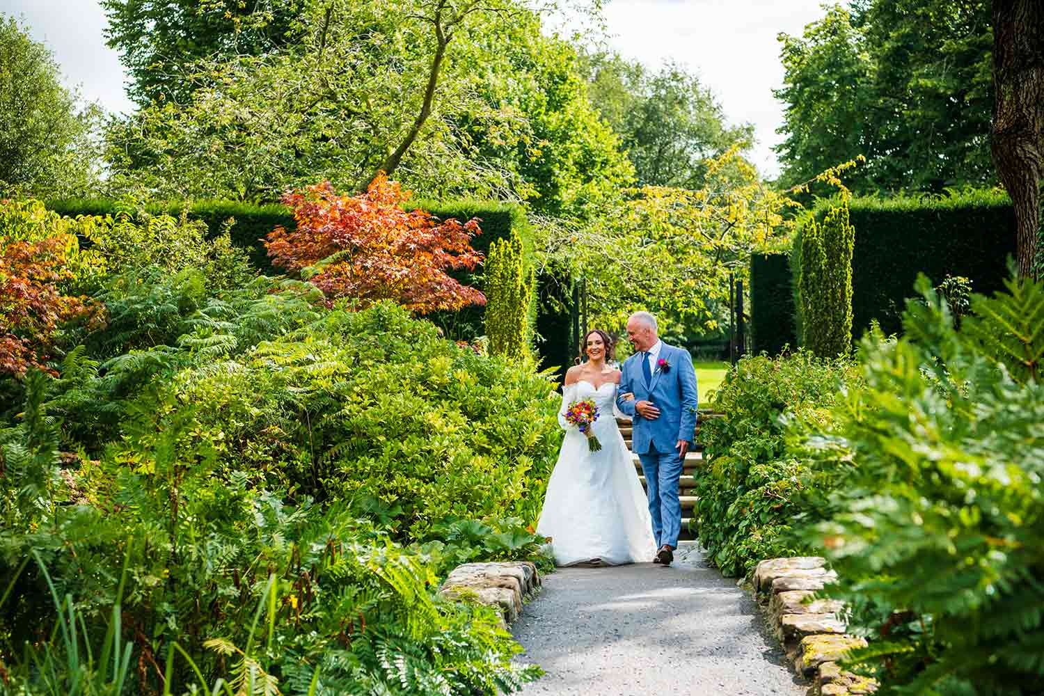 A bride walks through the Rock Garden prior to a wedding ceremony.