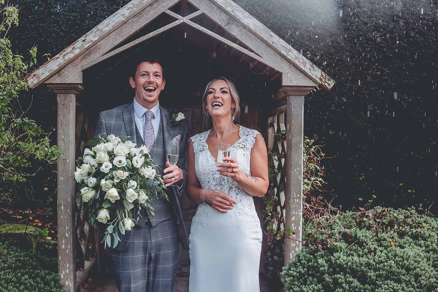 A couple toast their wedding in the Rock Garden.