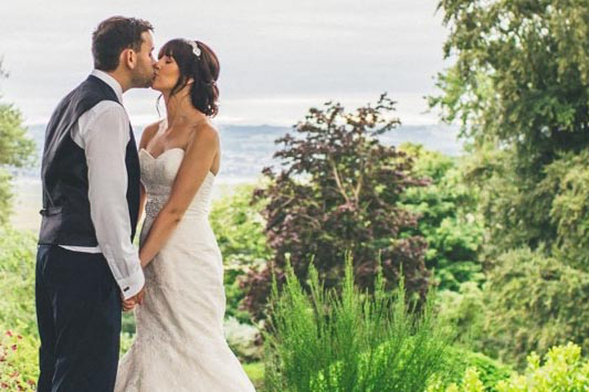 A couple on their wedding day at Ness Botanic Gardens.